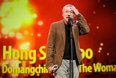 Director+Hong+Sangsoo_+winner+of+the+Silver+Bear+for+Best+Director+for+the+film+The+Woman+Who+Ran+is+seen+on+stage+at+the+closing+ceremony+of+the+70th+Berlinale+Int
