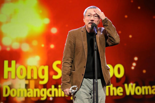 Director+Hong+Sangsoo_+winner+of+the+Silver+Bear+for+Best+Director+for+the+film+The+Woman+Who+Ran+is+seen+on+stage+at+the+closing+ceremony+of+the+70th+Berlinale+Int