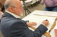 Esrafil Shirchi's workshop at the Etihad Museum in the first Dubai Calligraphy Biennale
